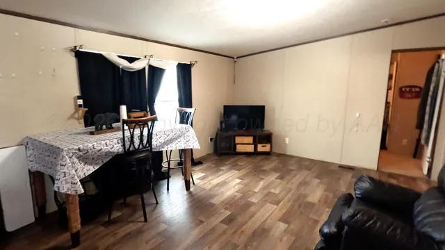 a bedroom with a bed and dresser