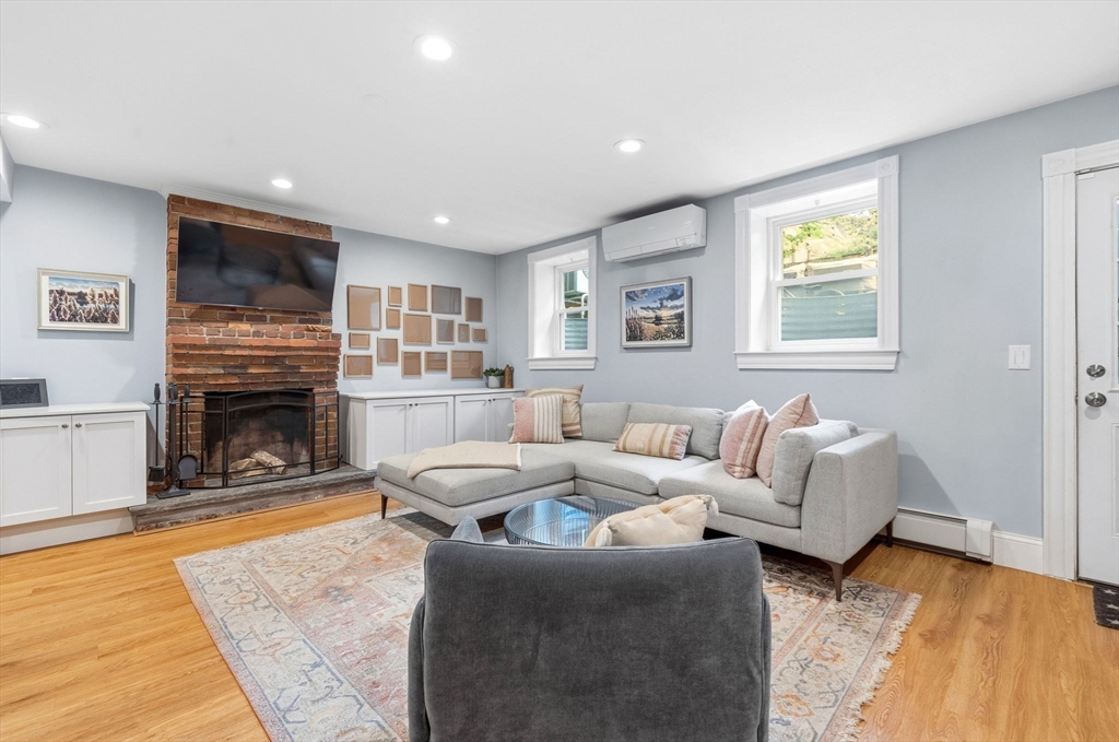 35 High Street, Unit 1 Boston, MA 02129 - Photo 26 of 33 a living room with furniture and a fireplace