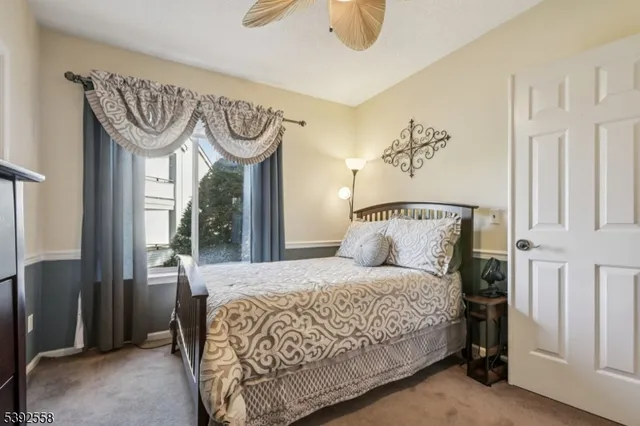 a bedroom with a bed and closet with window