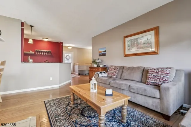 a living room with furniture and a rug
