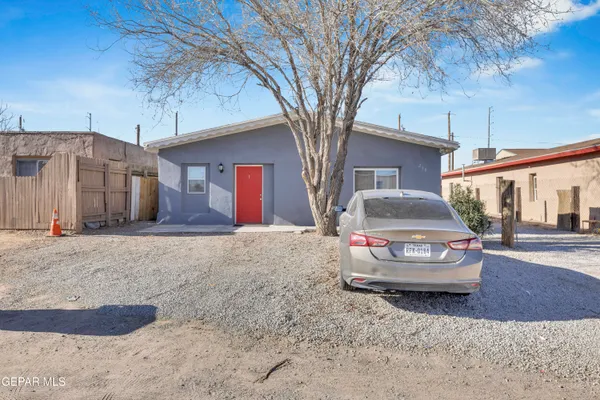 a car parked in front of a house