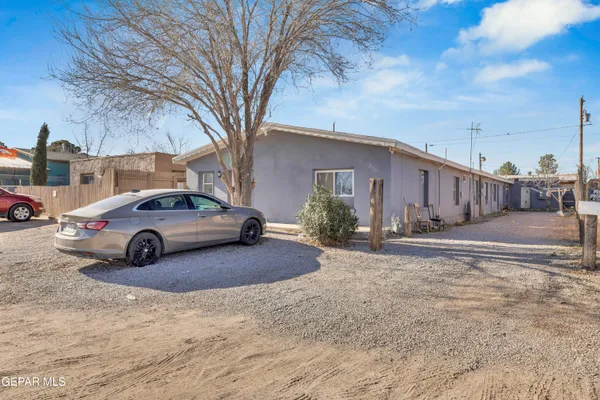 a view of a car parked in front of a house