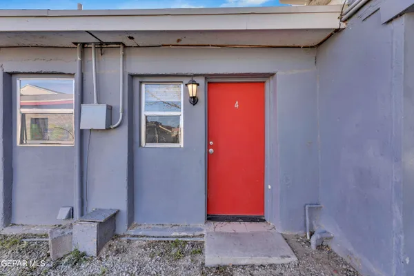 a backyard of a house with shaded area
