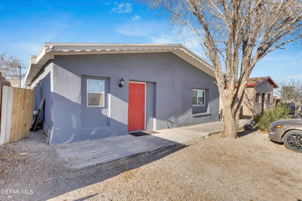 a front view of a house with parking space