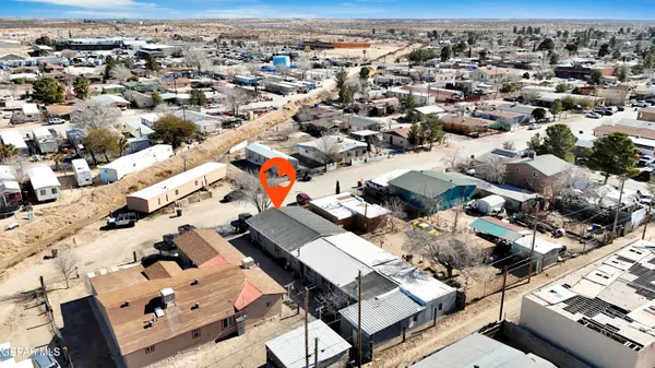 an aerial view of a house with a lake view