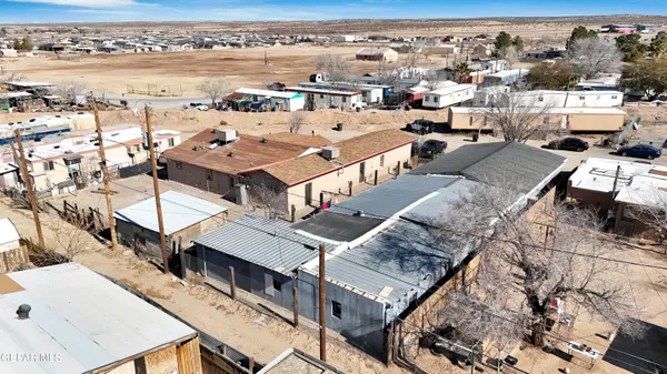 an aerial view of a house with a mountain view