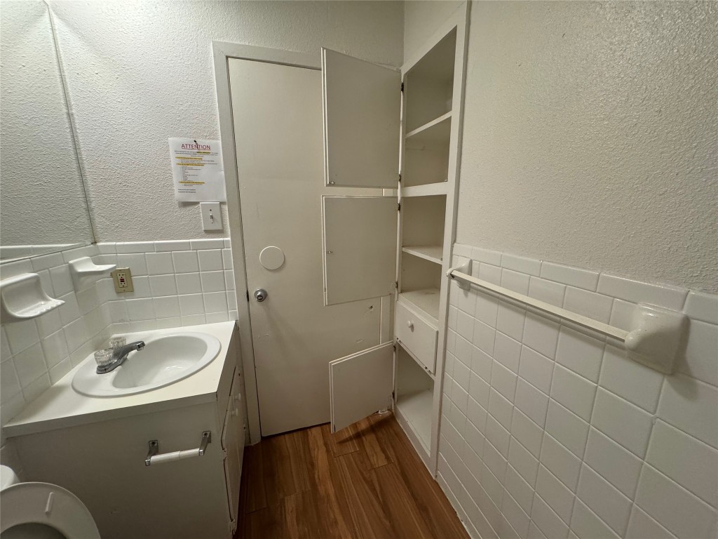 4810 West Wind Trail, Unit 103 Austin, TX 78745 - Photo 12 of 23 a bathroom with a sink toilet and shower
