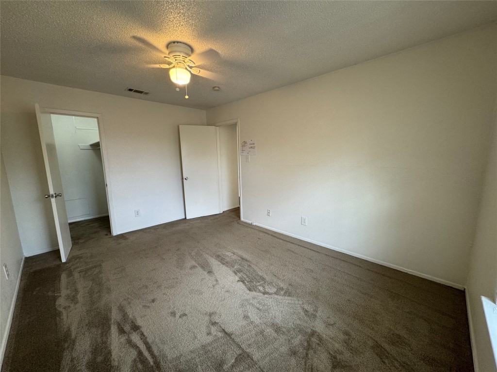4810 West Wind Trail, Unit 103 Austin, TX 78745 - Photo 17 of 23 a view of a livingroom with a ceiling fan and window