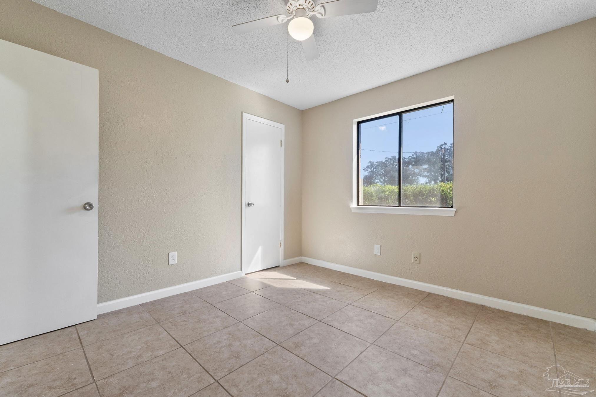 3135 Bent Oak Road Pensacola, FL 32526 - Photo 22 of 47 a view of an empty room with closet and a window