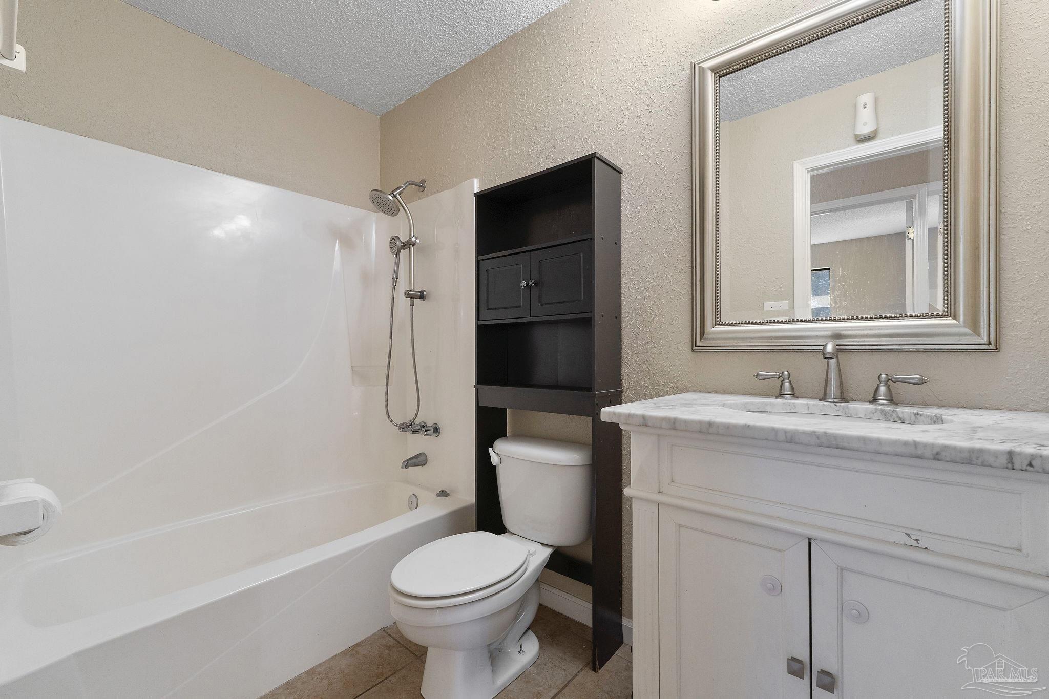 3135 Bent Oak Road Pensacola, FL 32526 - Photo 25 of 47 a bathroom with a granite countertop sink toilet and shower