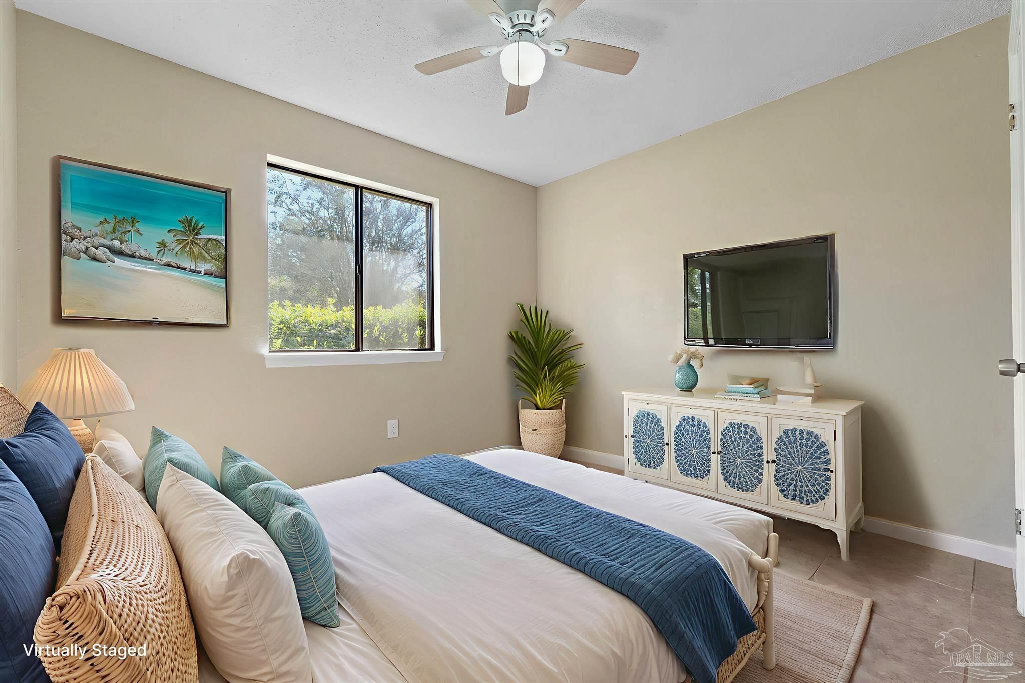 3135 Bent Oak Road Pensacola, FL 32526 - Photo 27 of 47 a bedroom with a bed and a flat screen tv
