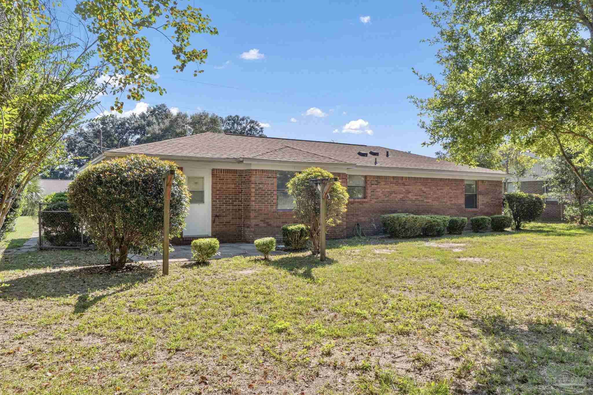 3135 Bent Oak Road Pensacola, FL 32526 - Photo 31 of 47 a front view of a house with a yard