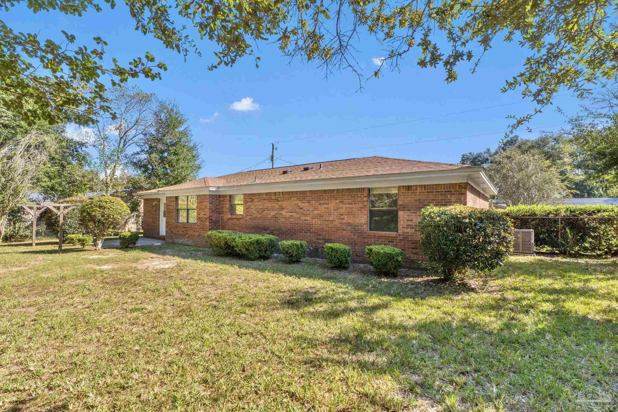 3135 Bent Oak Road Pensacola, FL 32526 - Photo 32 of 47 a view of a house with a yard