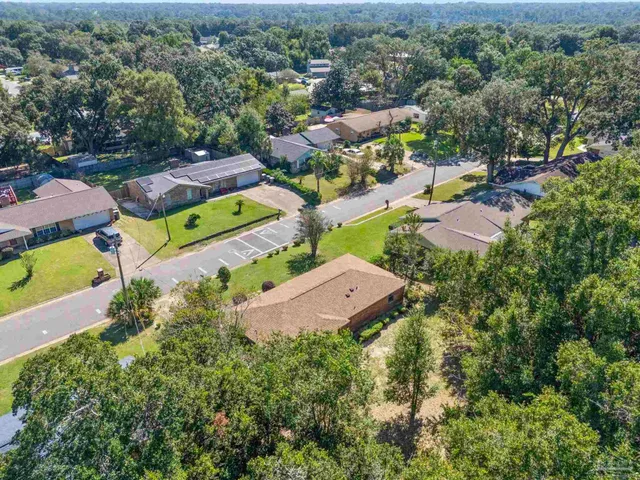 an aerial view of a house with a garden