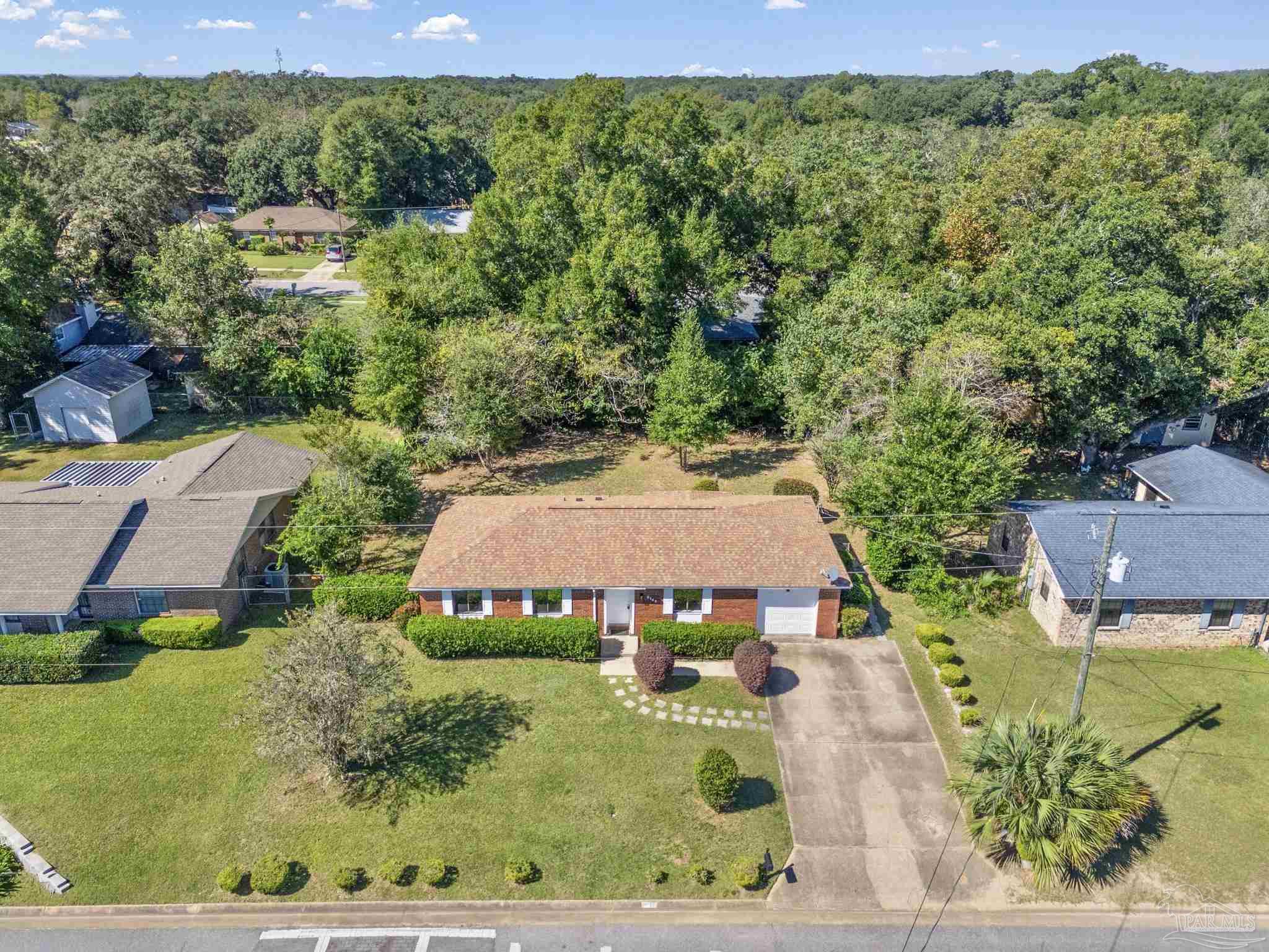 3135 Bent Oak Road Pensacola, FL 32526 - Photo 41 of 47 an aerial view of multiple houses with a yard