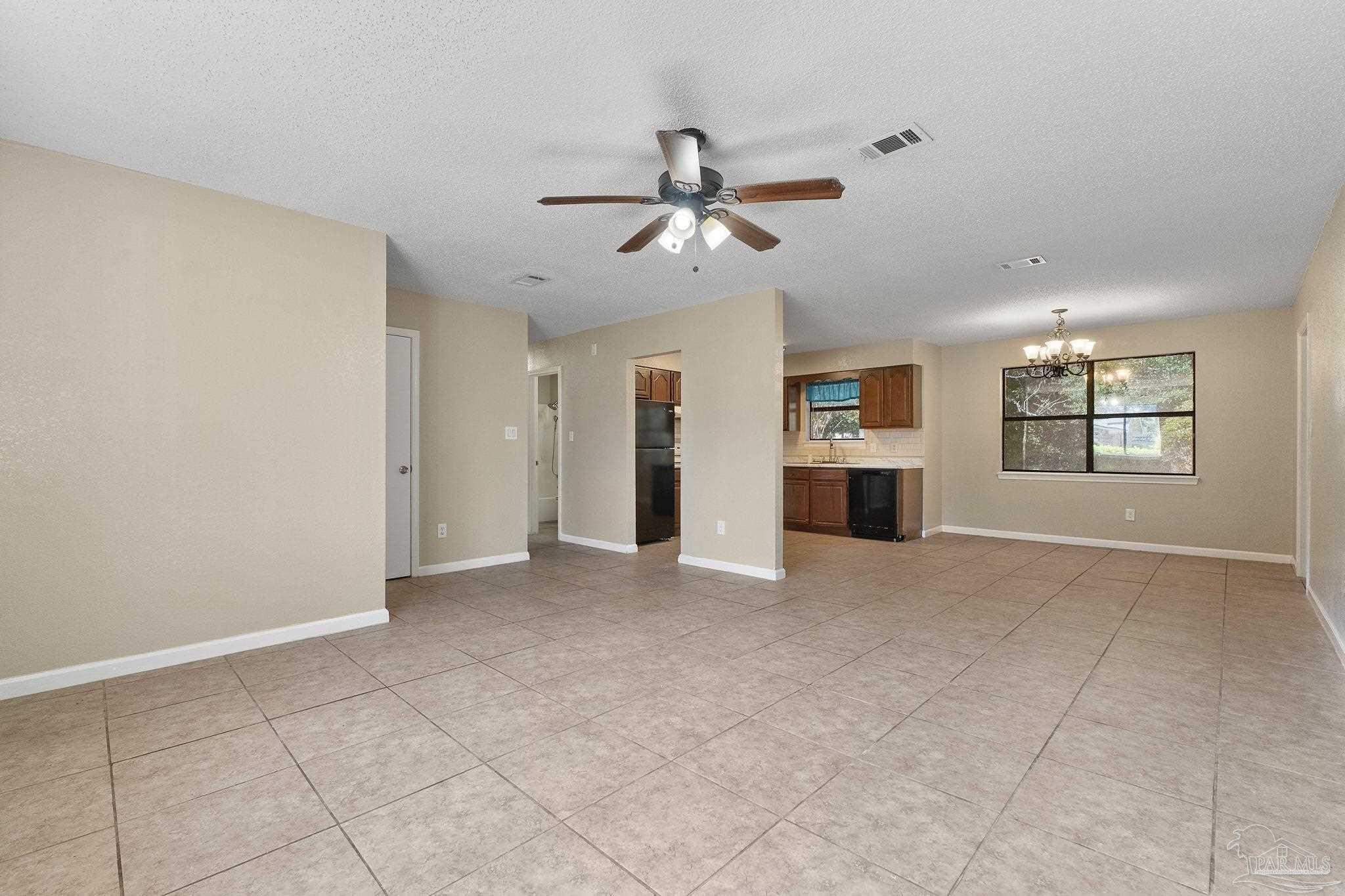 3135 Bent Oak Road Pensacola, FL 32526 - Photo 5 of 47 a view of empty room with a fireplace and window