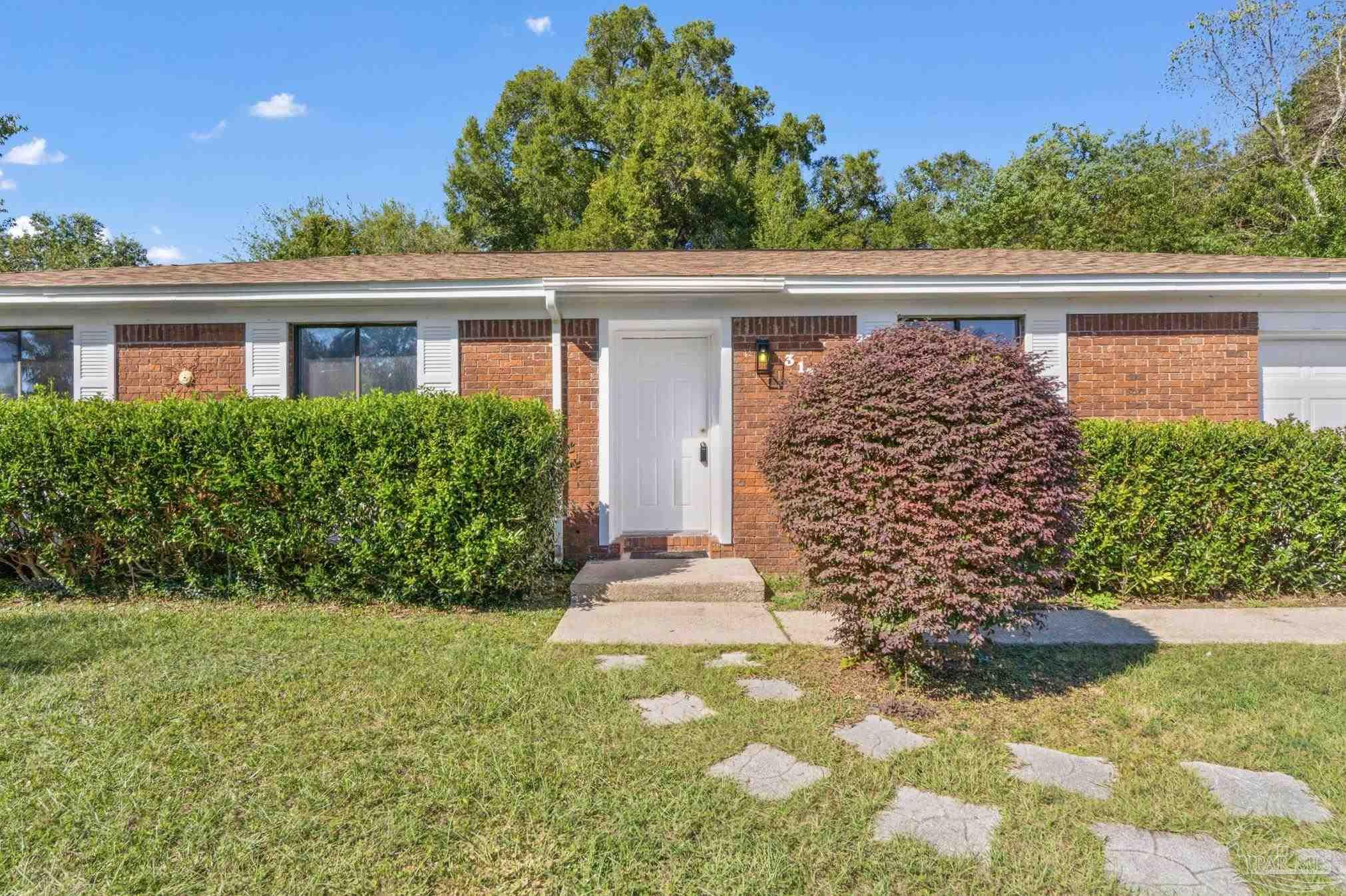 3135 Bent Oak Road Pensacola, FL 32526 - Photo 8 of 47 a front view of a house with garden