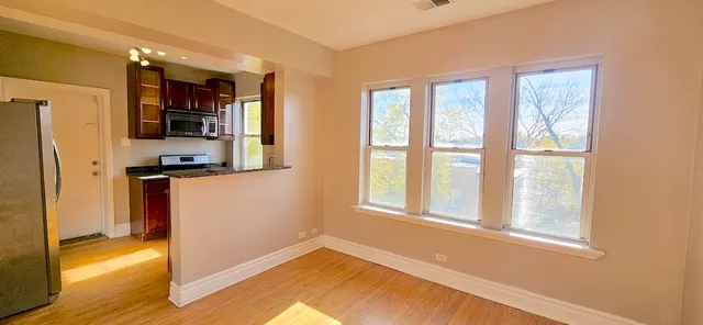 a view of a kitchen and a windows