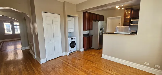 a view of hallway with wooden floor