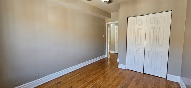 a view of wooden floor in an empty room