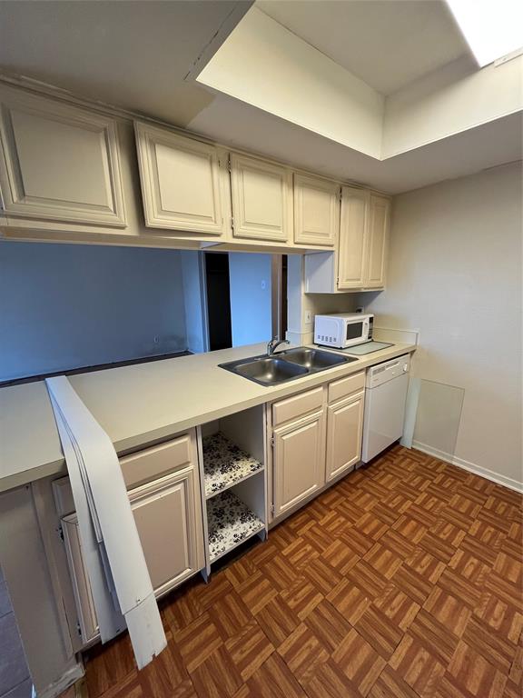 4460 Chaha Road, Unit 205 Garland, TX 75043 - Photo 9 of 27 a utility room with sink dryer and washer