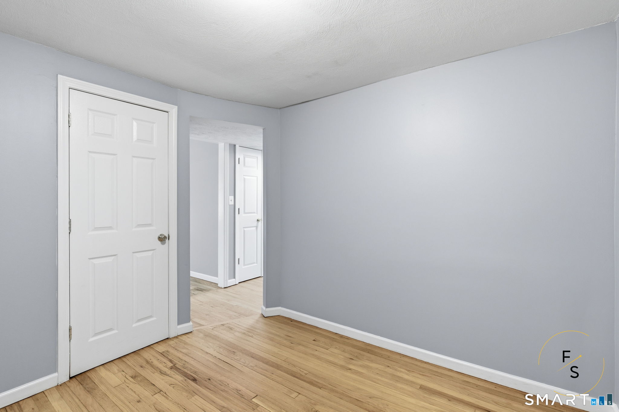 57 Concord Circle Wethersfield, CT 06109 - Photo 14 of 37 a view of an empty room with wooden floor
