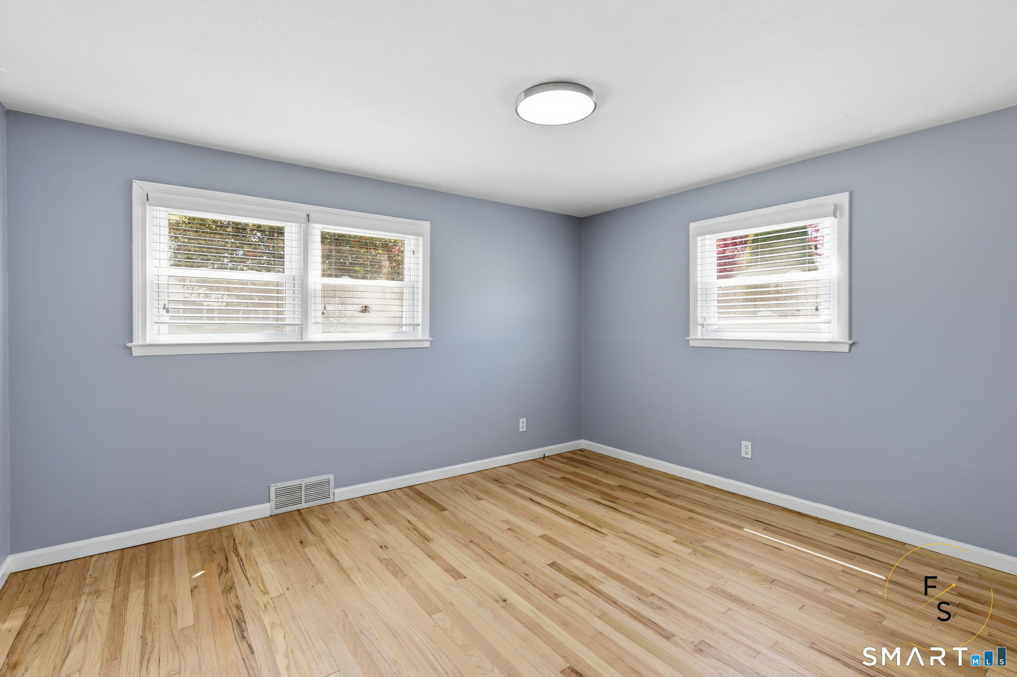 57 Concord Circle Wethersfield, CT 06109 - Photo 16 of 37 a view of an empty room with wooden floor and a window