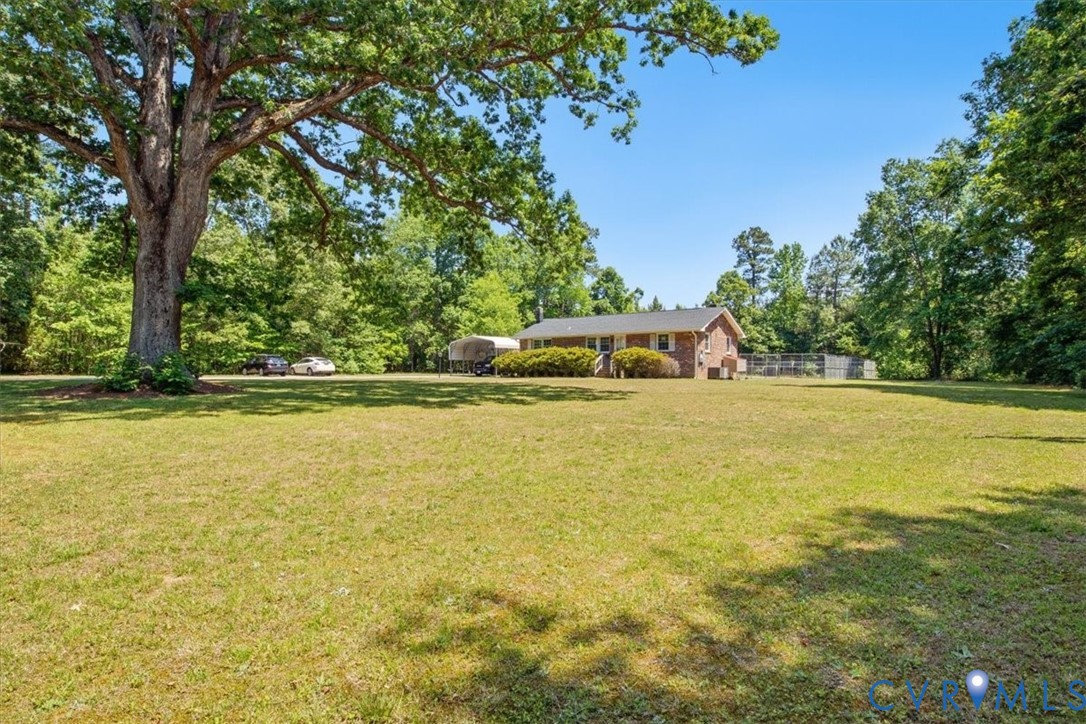 15503 Eppes Road Dewitt, VA 23840 - Photo 16 of 22 a view of a swimming pool with an outdoor space and seating area