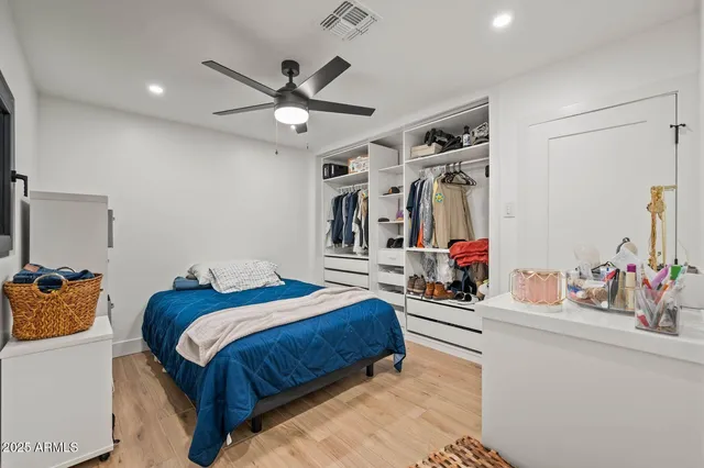 a bedroom with a bed and a dresser