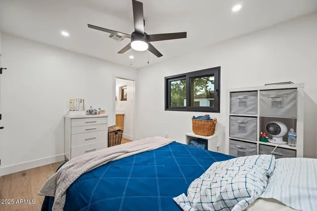 a bedroom with bed and furniture