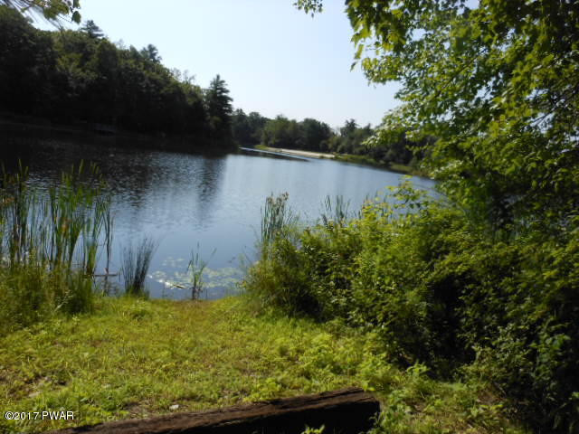 207 Aspen Road Dingmans Ferry, PA 18328 - Photo 22 of 22 a view of a lake from a yard