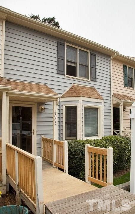 6603 Orford Court Raleigh, NC 27615 - Photo 2 of 14 a view of a house with a yard