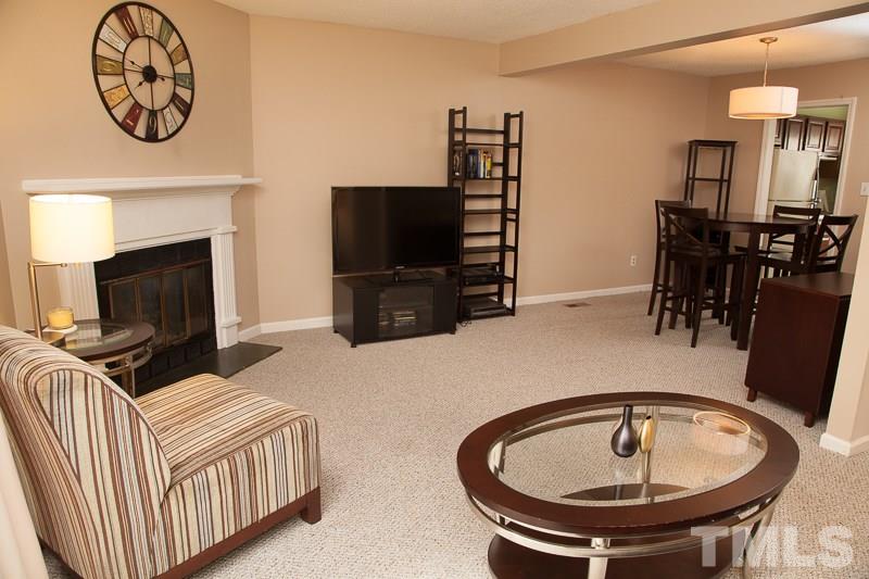 6603 Orford Court Raleigh, NC 27615 - Photo 5 of 14 a living room with furniture and a flat screen tv