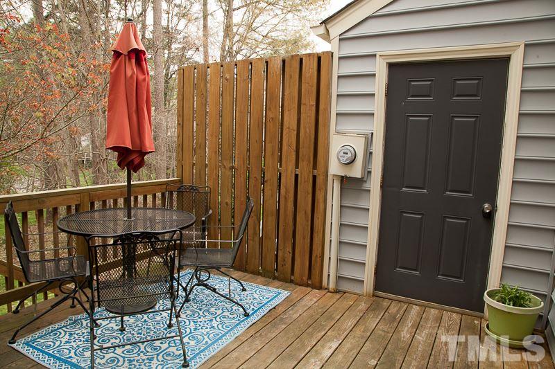 6603 Orford Court Raleigh, NC 27615 - Photo 6 of 14 a view of a balcony with furniture and wooden floor