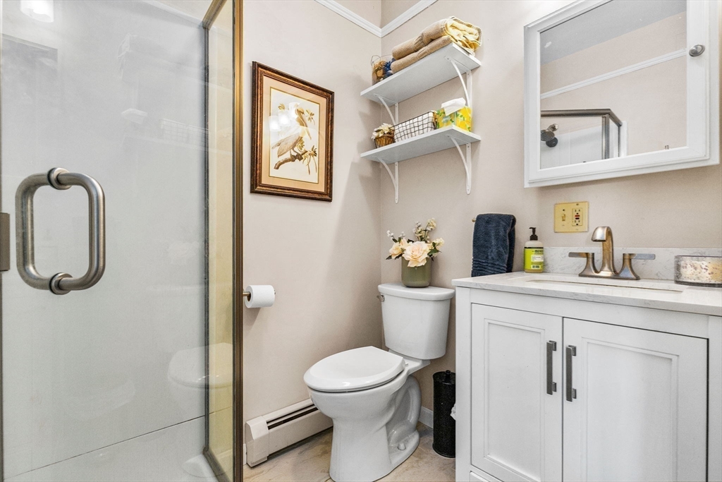 34 Cliff Road Hingham, MA 02043 - Photo 13 of 24 a bathroom with a toilet and a sink