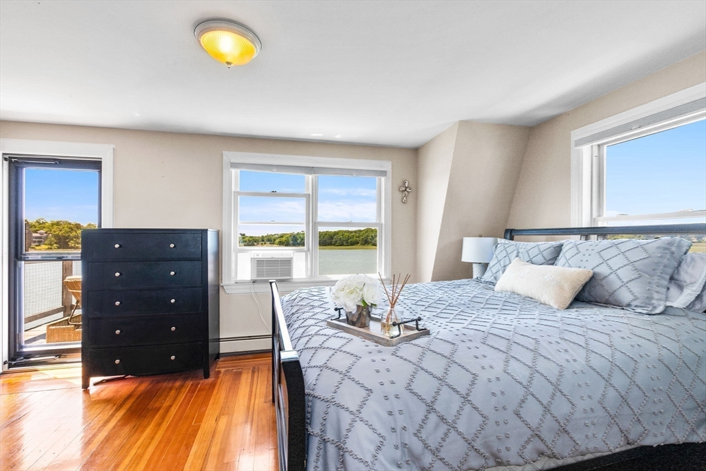 34 Cliff Road Hingham, MA 02043 - Photo 17 of 24 a bedroom with a bed and a window