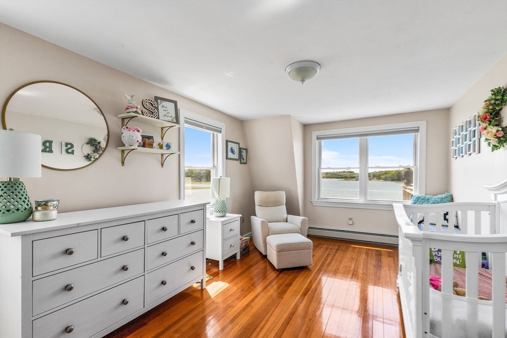 34 Cliff Road Hingham, MA 02043 - Photo 19 of 24 a living room with furniture and a large window