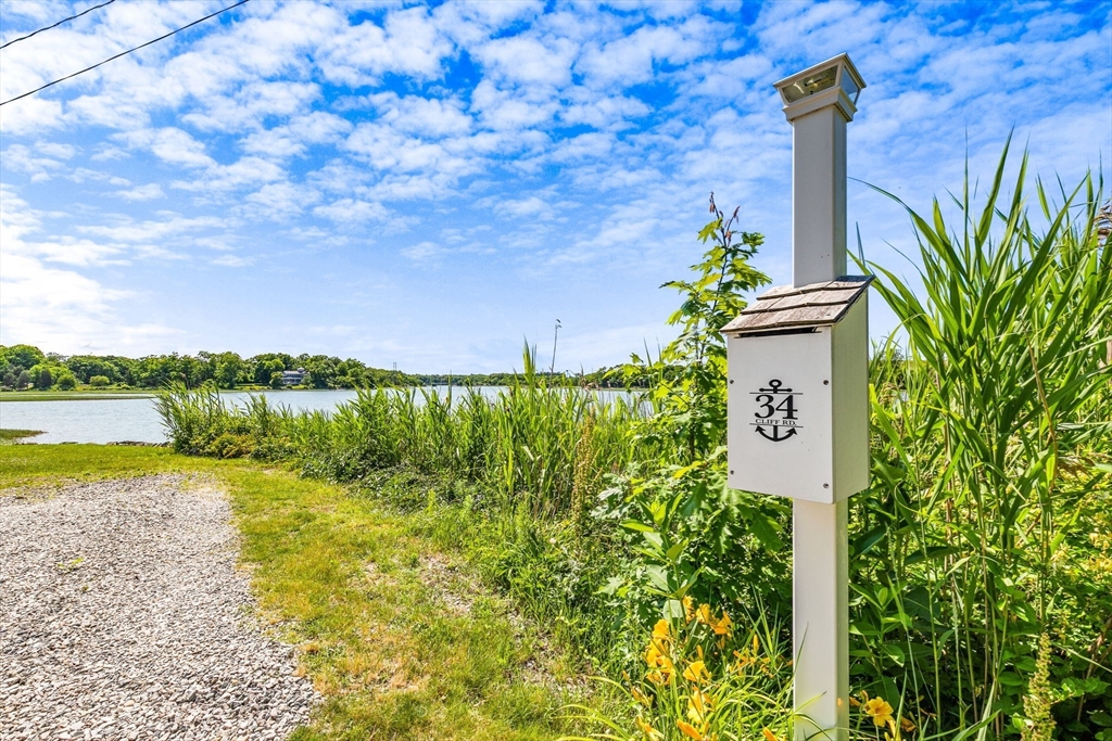 34 Cliff Road Hingham, MA 02043 - Photo 20 of 24 a view of a yard with an ocean view