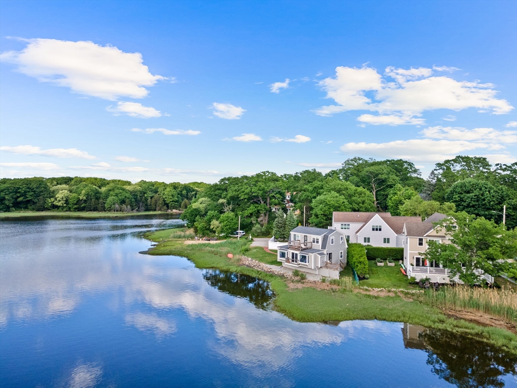 34 Cliff Road Hingham, MA 02043 - Photo 23 of 24 a view of a lake with houses in the back