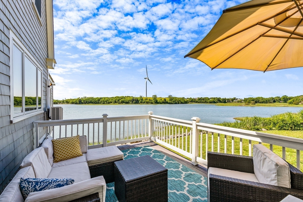 34 Cliff Road Hingham, MA 02043 - Photo 3 of 24 a view of a balcony with lake view and wooden floor