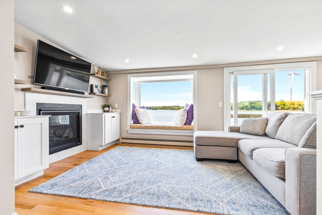 34 Cliff Road Hingham, MA 02043 - Photo 8 of 24 a living room with furniture and a fireplace
