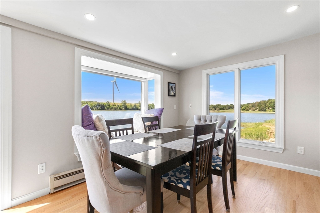 34 Cliff Road Hingham, MA 02043 - Photo 10 of 24 a view of a dining room with furniture window and wooden floor
