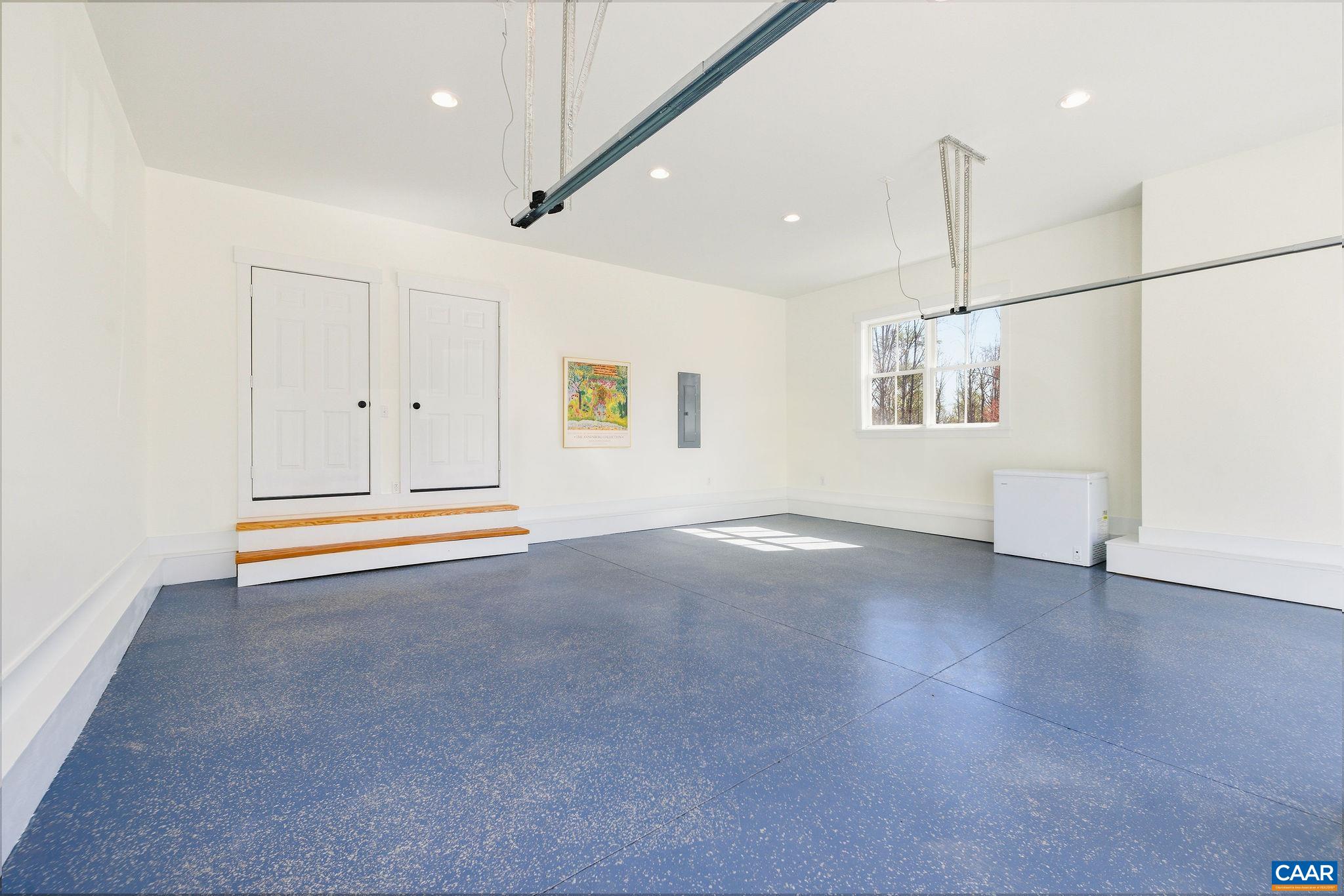 4764 Advance Mills Road Earlysville, VA 22936 - Photo 65 of 72 an empty room with wooden floor and windows