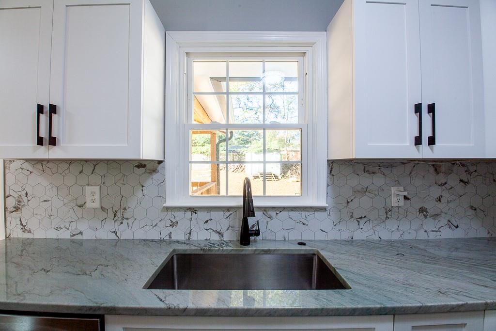 13 Shadow Lane Cartersville, GA 30120 - Photo 20 of 36 a kitchen with a sink and cabinets