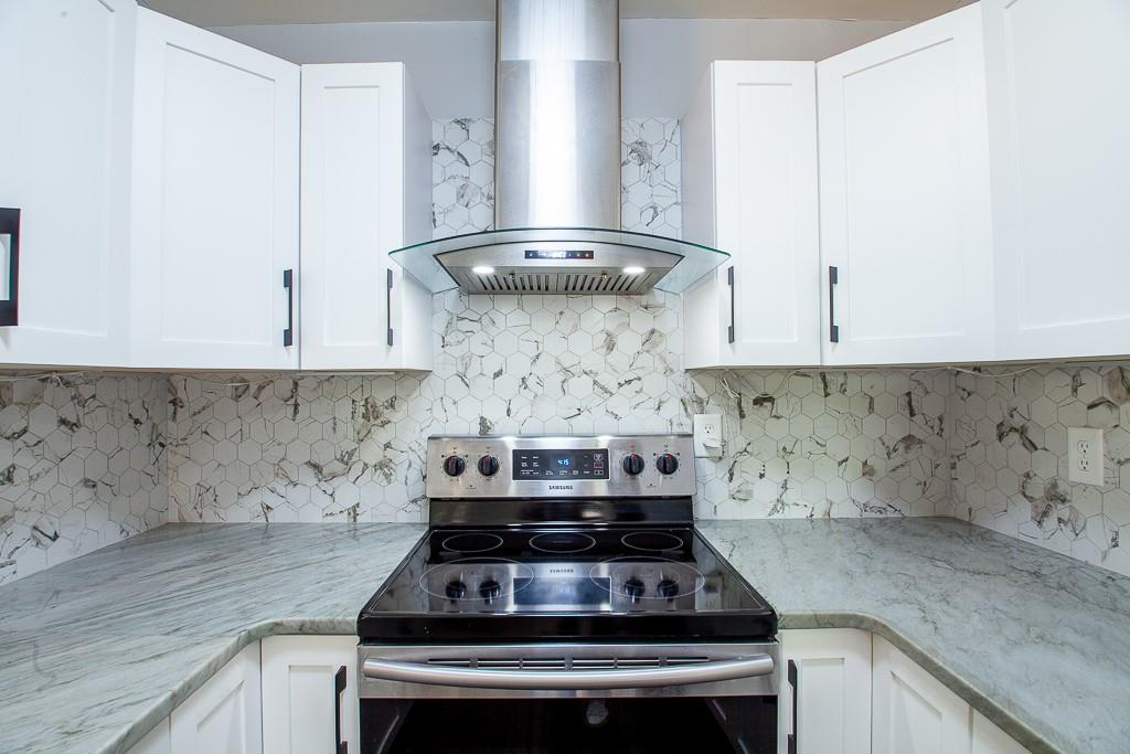 13 Shadow Lane Cartersville, GA 30120 - Photo 21 of 36 a stove top oven sitting inside of a kitchen