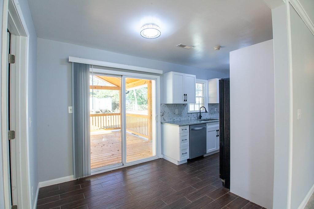 13 Shadow Lane Cartersville, GA 30120 - Photo 22 of 36 a view of a kitchen and an empty room with a window
