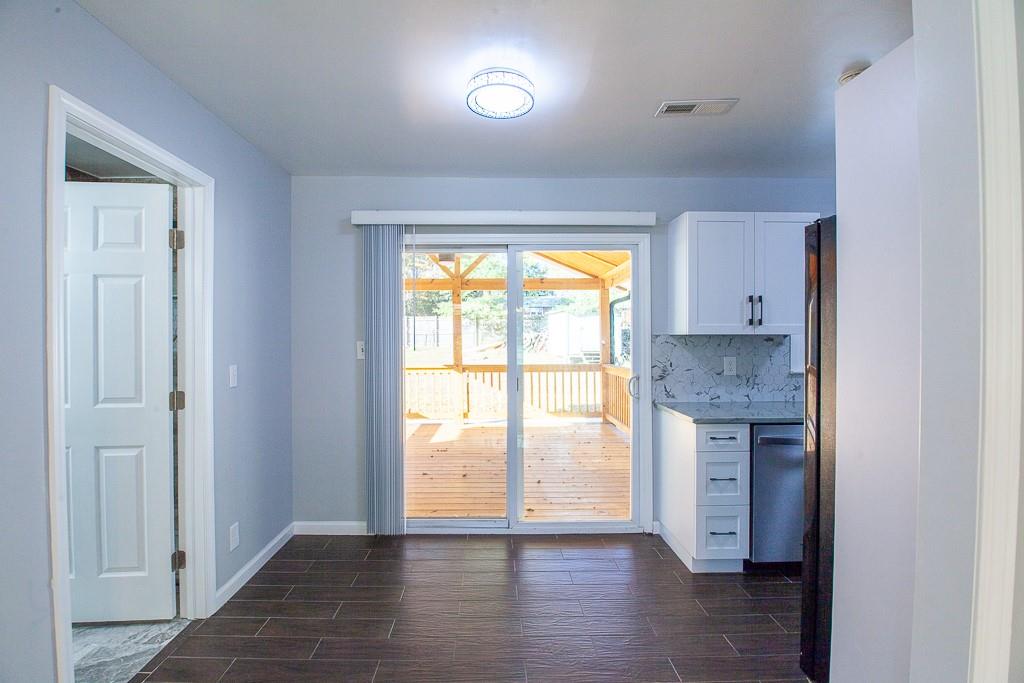 13 Shadow Lane Cartersville, GA 30120 - Photo 23 of 36 wooden floor in an empty room with a window and wooden floor