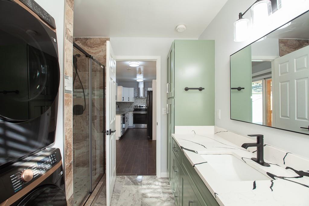 13 Shadow Lane Cartersville, GA 30120 - Photo 26 of 36 a en suite bathroom with a sink a mirror and shower