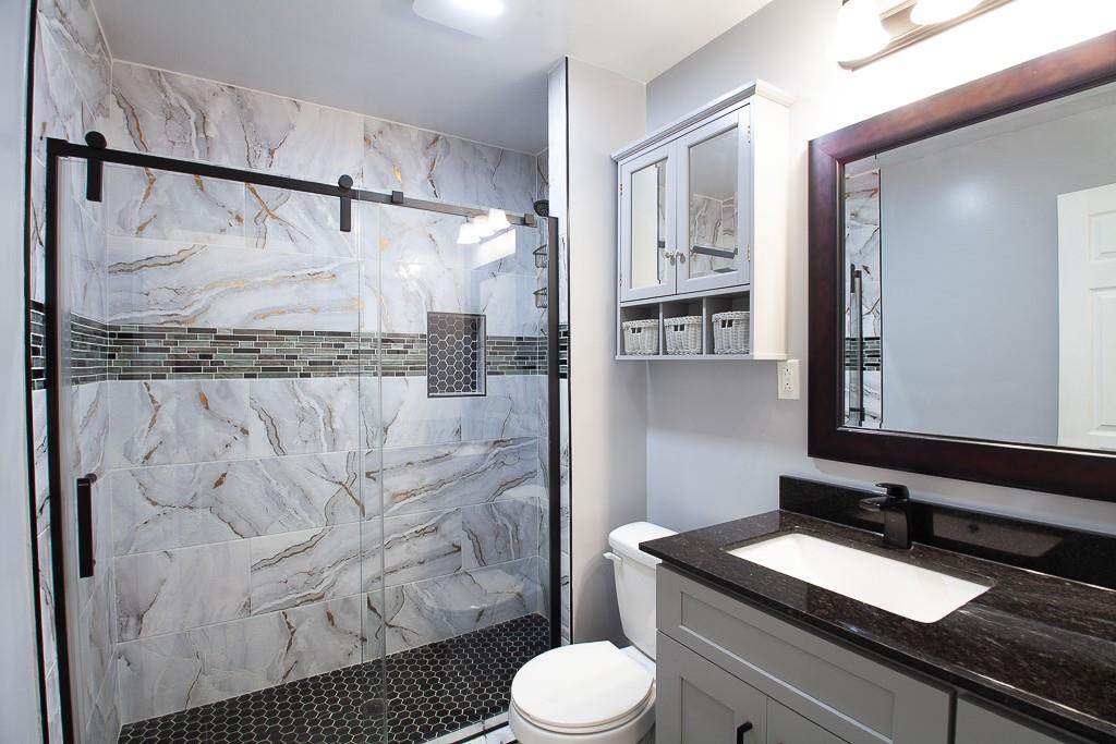 13 Shadow Lane Cartersville, GA 30120 - Photo 35 of 36 a bathroom with a granite countertop sink toilet and shower