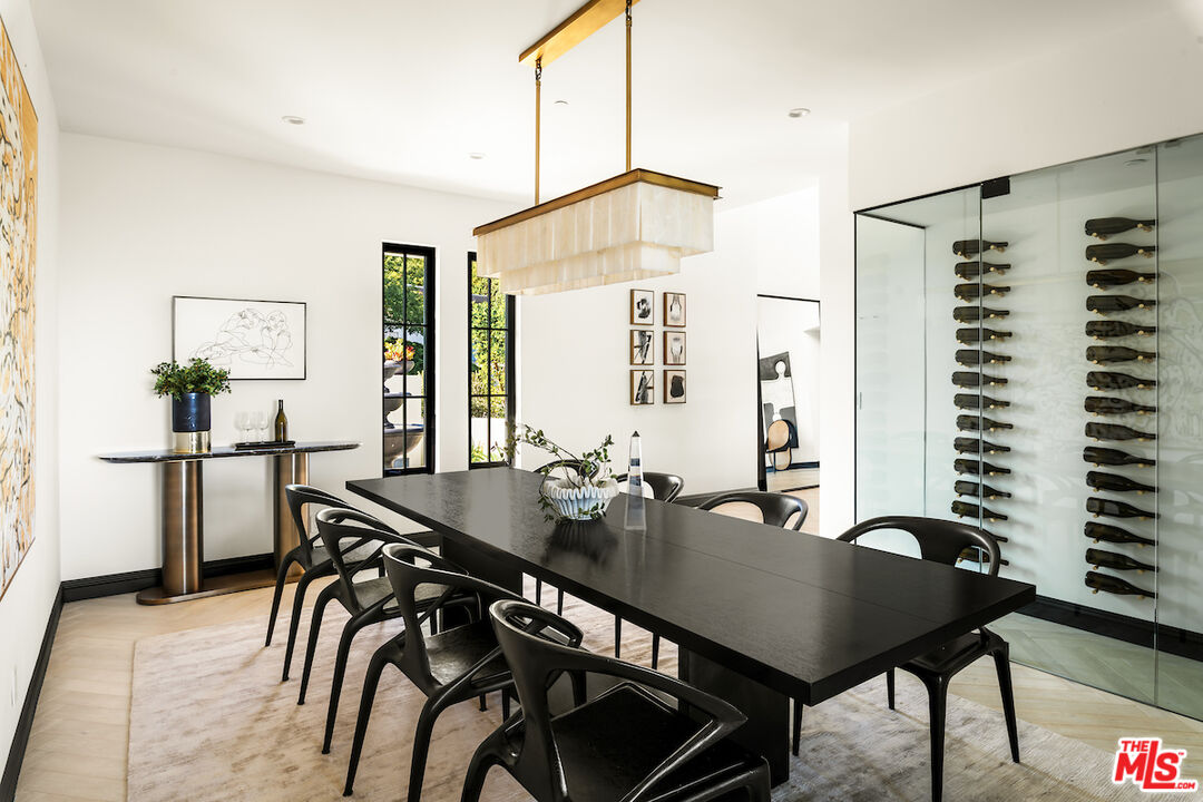 10932 Savona Road Los Angeles, CA 90077 - Photo 25 of 72 a view of a dining room with furniture and window